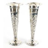 A pair of early 20thC silver vases, by William Comyns and Sons, of tapering trumpet form with a flut