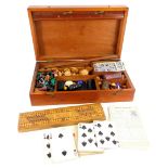 A late 19th/ early 20thC mahogany games box or compendium, to include draughts, cribbage, dominoes,