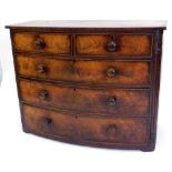 A Victorian mahogany bowfronted chest of drawers, with two short and three long drawers, with turned