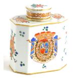 A continental porcelain tea caddy and cover, of canted rectangular form, decorated with armorial lea