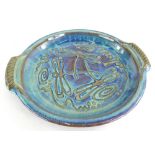 A Will Illsley studio pottery two handled dish, with purple and turquoise high fired lustre glazes,