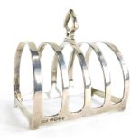 A Mappin and Webb four division silver toast rack, with a shield shaped handle, Sheffield 1934, 2½oz