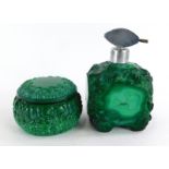 Two 1920s/30s mottled green glass dressing table items, to include a scent bottle and a jar and cove