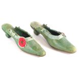 A pair of 19thC ladies green leather shoes, embellished with fabric rosette and cut steel, 25cm long