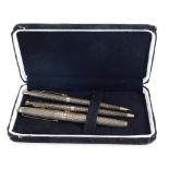 A sterling silver Parker pen set, to include fountain pen, propelling pencil and ball point, each wi