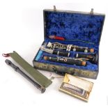 A Boosey and Hawkes clarinet, in a fitted case, a Coch Chromatic harmonica and a Schotts C Descant r