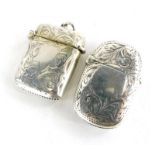 Two silver Vesta cases, to include a George V rectangular example decorated with scrolls, leaves, et