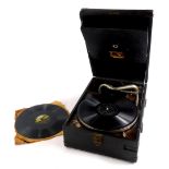 A HMV black canvas cased portable gramophone, with single 78 record.