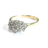 A 9ct gold dress ring, set with tiny white stones, in claw setting, ring size M, 2.2g all in.