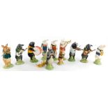 A collection of Beswick pig figures, each playing a musical instrument, to include Richard, Benjamin