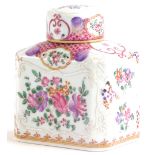A continental porcelain tea caddy and lid, decorated in famille rose palette with flowers, leaves, e