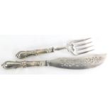 A Victorian silver handled fish servers, the handles cast with scrolls etc., possibly by Joseph Roge