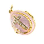 A plated and enamelled egg pendant, on a pink enamel backing cross set with white stones, opening to
