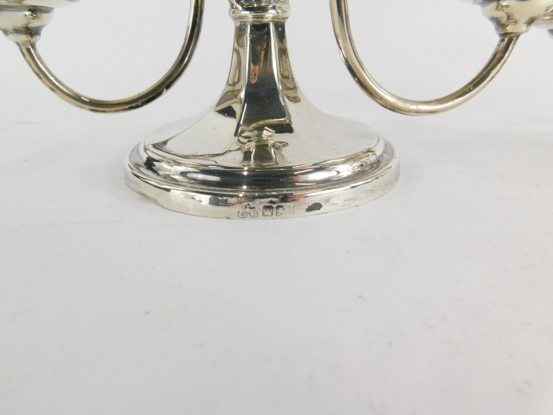 A pair of Edward VII two branch candelabrum, in Georgian style, the column centered with a panelled - Image 2 of 2