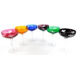 A harlequin set of six Bohemian style champagne glasses, each with a coloured bowl.
