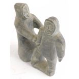 A Inuit stone carving of two Eskimos, label for Kinaaluk Ningicrlut, of Wakeham Bay, possible date 1