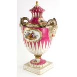 A late 19thC German porcelain two handled vase and cover, the lid with a gilt finial and pierced sid