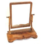 A Victorian mahogany dressing table mirror, the rectangular plate, shaped supports and serpentine fr