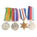 A collection of two WWII medals, The France Germany Star, and two further medals, the WWII Defence m