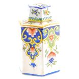 A French faience hexagonal shaped tea caddy and lid, decorated overall with flowers, leaves, etc., h