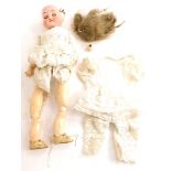 A bisque headed doll, the reverse stamped 1909, 0 Germany, with composition limbs etc. (AF).