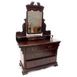 An Edwardian mahogany dressing table, the raised back with a shaped bevel mirror plate on shaped sup