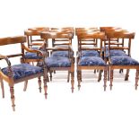 A set of twelve early Victorian mahogany dining chairs, each with a bar back, a drop in seat .