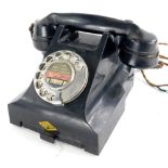 A vintage black Bakelite telephone, label to front for Shipton, number to underside 4509B.