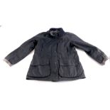 A ladies Barbour black wax jacket, size 14.