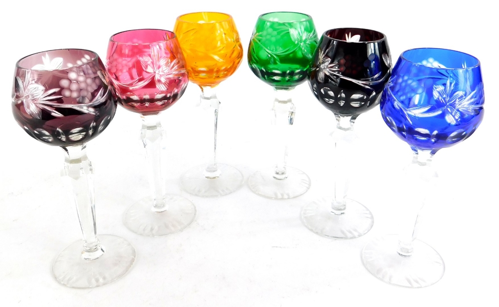 A harlequin set of six Bohemian style port glasses, each with a coloured cut glass bowl.