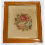 A Victorian wool work picture, still life with roses, etc., on linen backing with birds eye maple fr