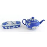 A Wedgwood Jasperware miniature teapot and cover, and a similar rectangular box and cover, possibly