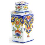 A French faience octagonal tea caddy and lid, decorated overall with flowers, scrolls, leaves, etc.,