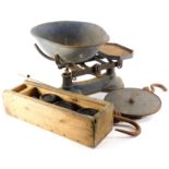 A Salter's brass and iron spring balance, a set of shop scales, and a box of iron weights.