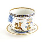 A Gien faience pottery jardiniere, decorated with putti, mythical creatures, etc., and a matching st