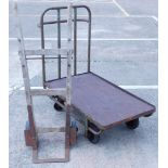 An Industrial grill painted tubular iron trolley, with hardwood top, 30cm x 61cm, and a pair of oak