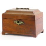 A George III mahogany tea caddy, the domed lid with a brass swing handle, enclosing a vacant interio