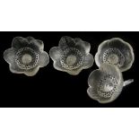 A set of four Lalique glass flowers. (AF)