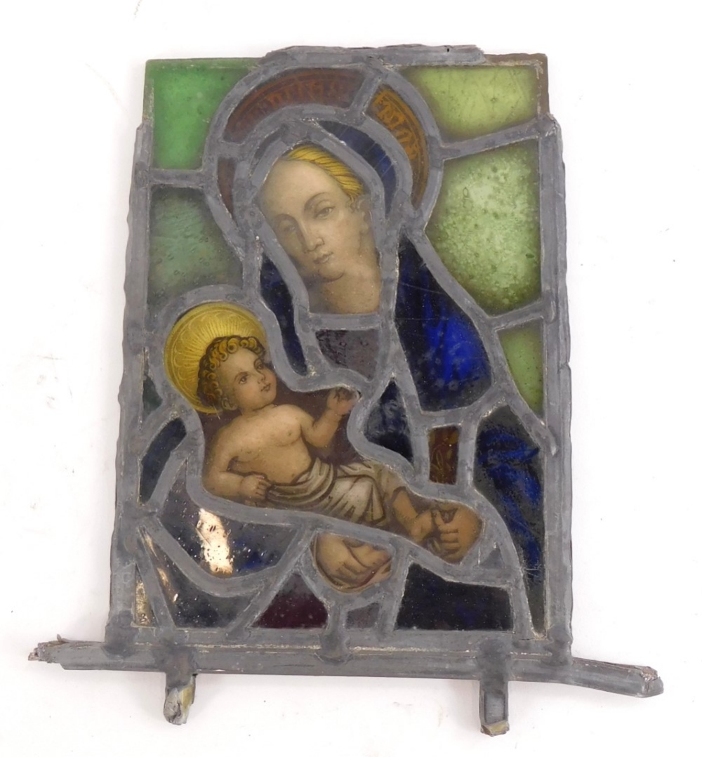 A stained glass panel, depicting Madonna and Child, leaded borders, possibly 18thC, 24cm x 17cm.