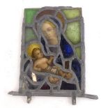 A stained glass panel, depicting Madonna and Child, leaded borders, possibly 18thC, 24cm x 17cm.