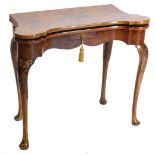 A mid 18thC walnut card table, the figured top with feather banded border and rounded corners, enclo