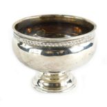 A small silver pedestal bowl, on a domed circular foot, marks rubbed, possibly Chester, 1¾oz, (AF).