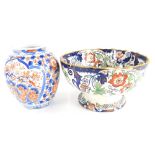 A Japanese Imari pattern porcelain vase, 21cm high, and an Amherst Japan pattern bowl. (2)