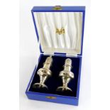 A pair of Elizabeth II silver pepper pots, of baluster form, in fitted box, Birmingham 1980. 5¾oz, 1