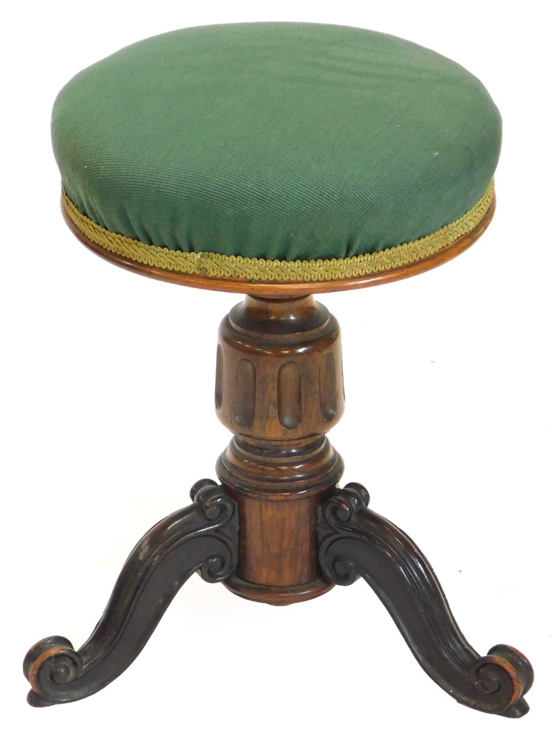 A Victorian rosewood adjustable piano stool, with a green upholstered padded seat, on a turned colum