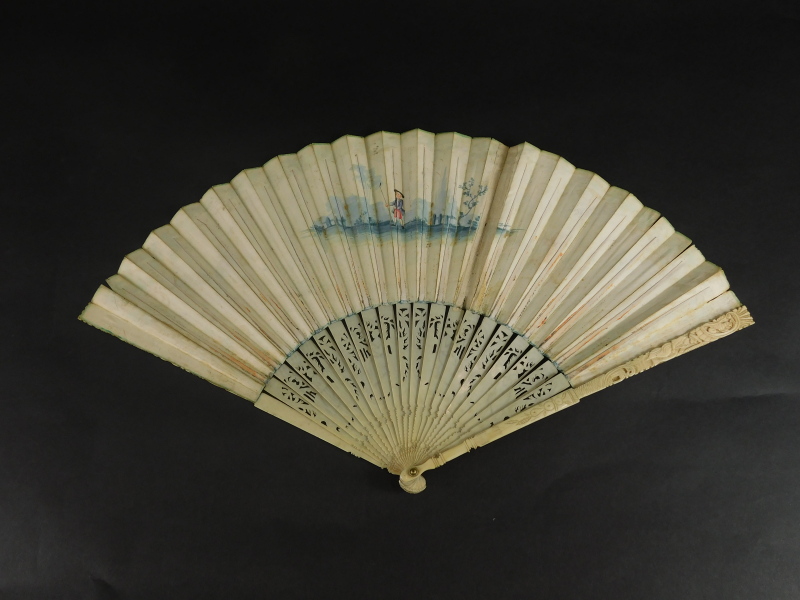 A 19thC continental fan, painted with figures within a landscape, a musician, etc, within a floral b - Image 2 of 3