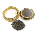 A group of jewellery, to include a Victorian gilt metal brooch frame, 6cm wide, a gilt metal swivel