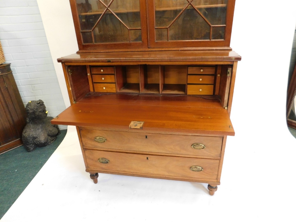 An early 19thC mahogany secretaire bookcase, the top with a moulded corner above two astragal glazed - Image 2 of 2