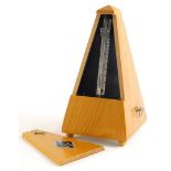 A German metronome, in an elm case, 22cm high.