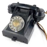 A vintage black Bakelite telephone, number to underside 4509B. (AF)